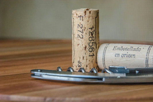 Wine cork with a corkscrew.