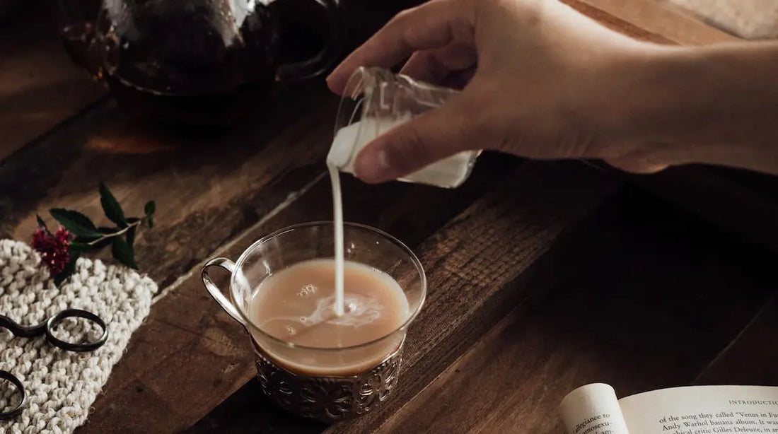 Pouring buttermilk into a coffee.