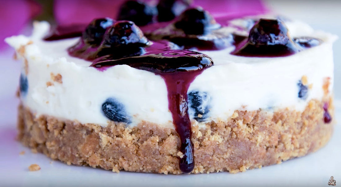 Blueberry cheesecake left out on kitchen counter.