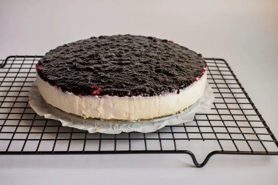 Cheesecake on a baking rack.