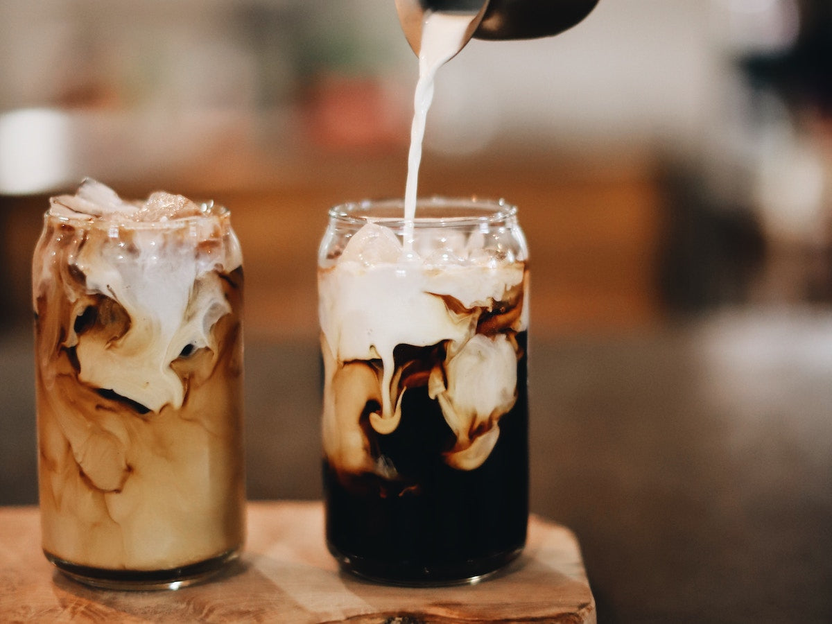 Cold coffees with poured milk