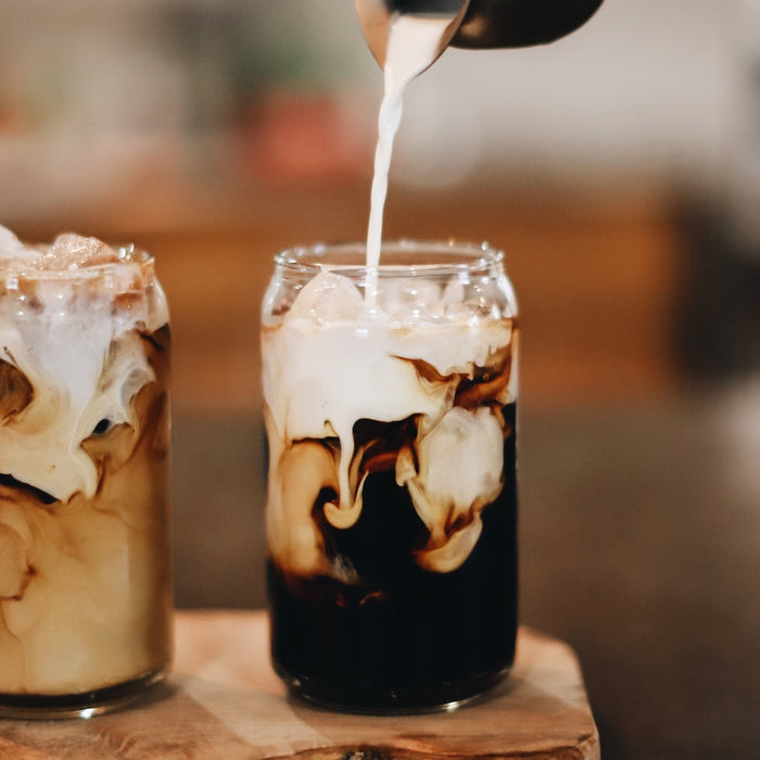 Cold coffees with poured milk