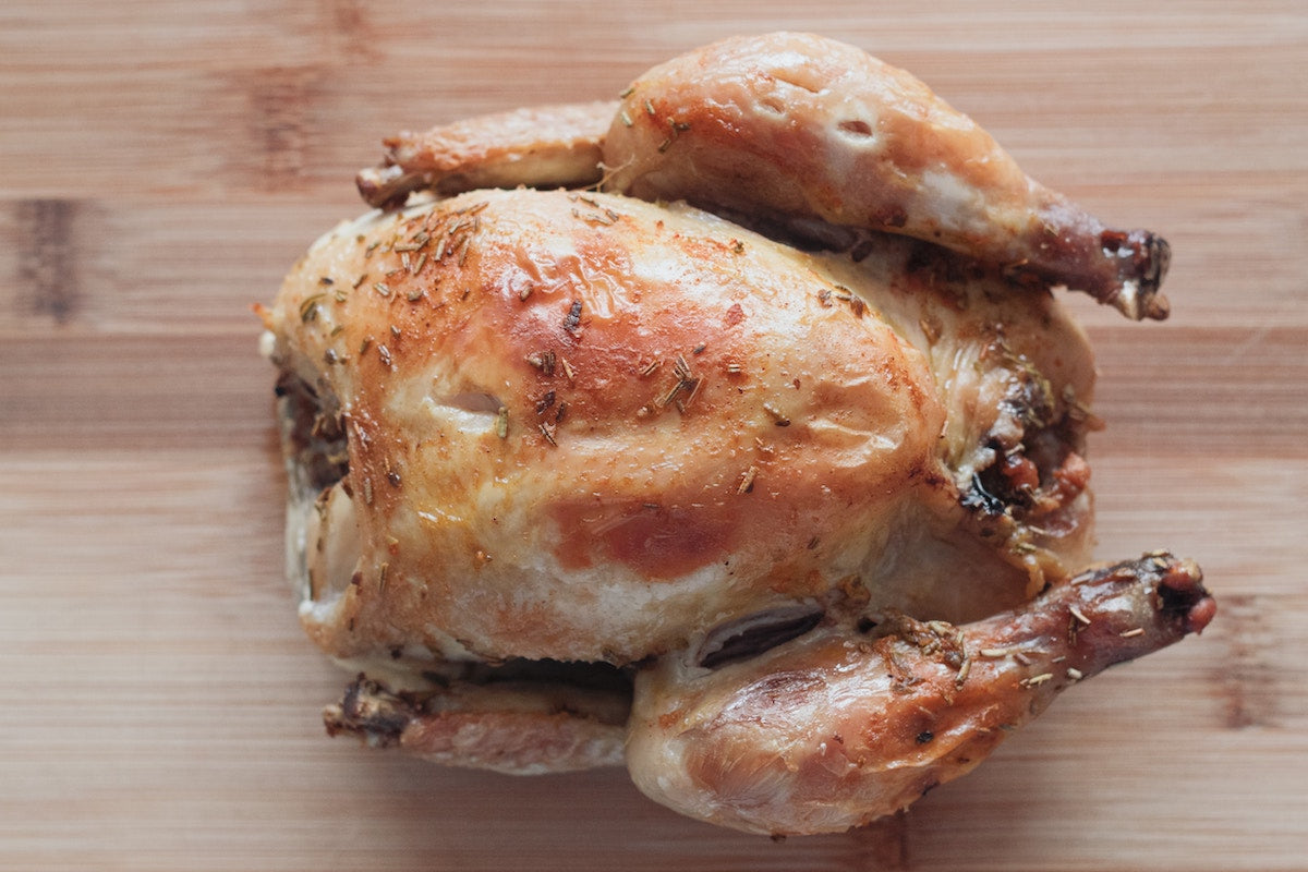 Roast chicken on a chopping board