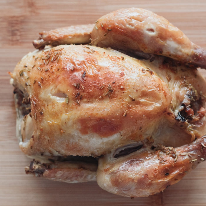 Roast chicken on a chopping board