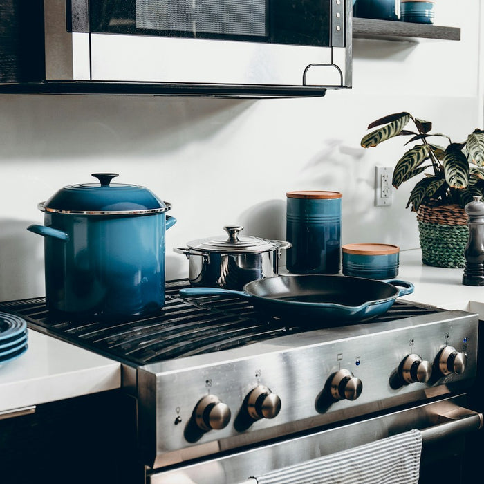 Double oven gas range in a kitchen.