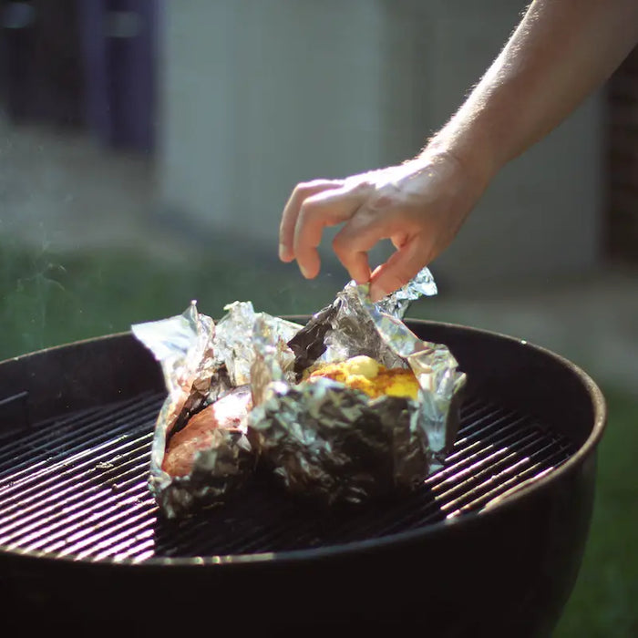 Tent with foil on a BBQ.