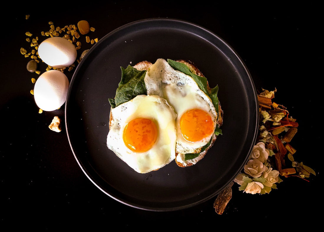 Fried eggs in a frying pan.