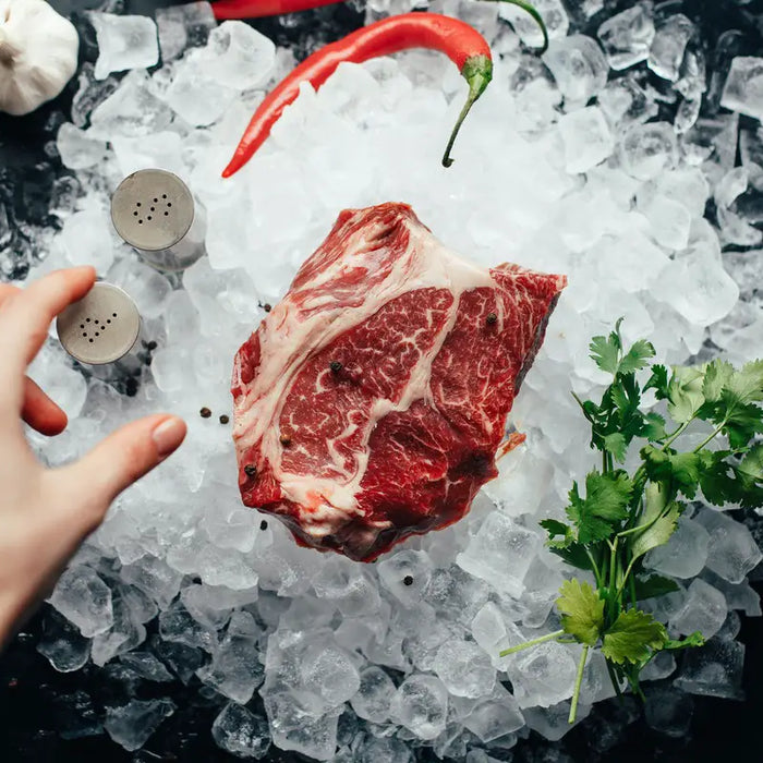 Ribeye steak on ice.