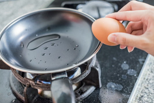Frying an egg in a non stick frying pan.