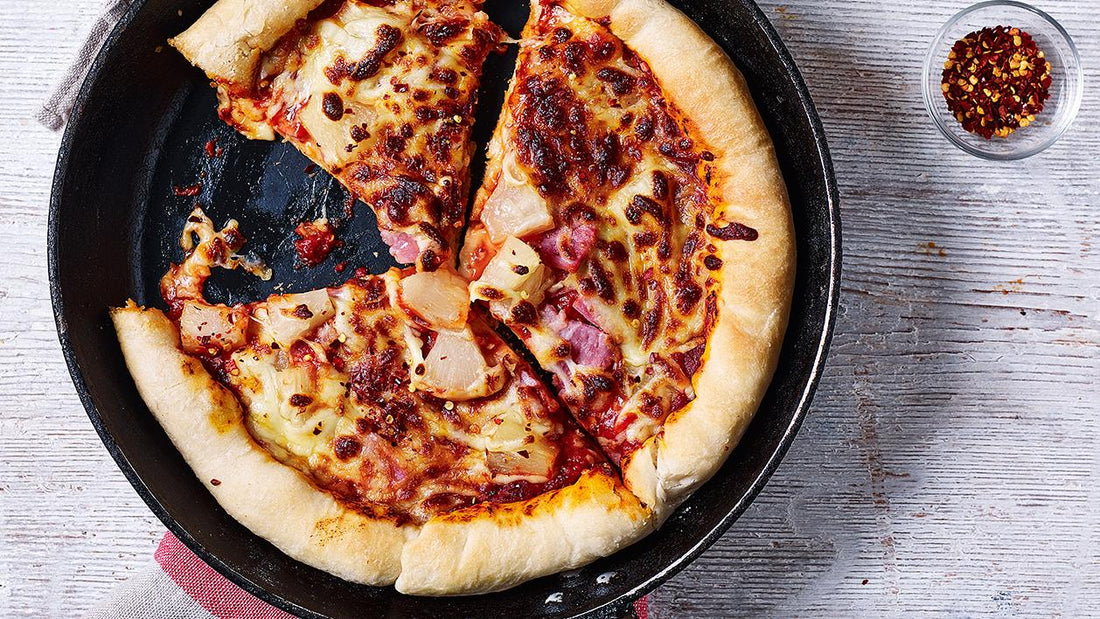 Pizza in a frying pizza pan.