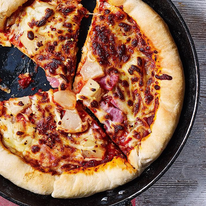 Pizza in a frying pizza pan.