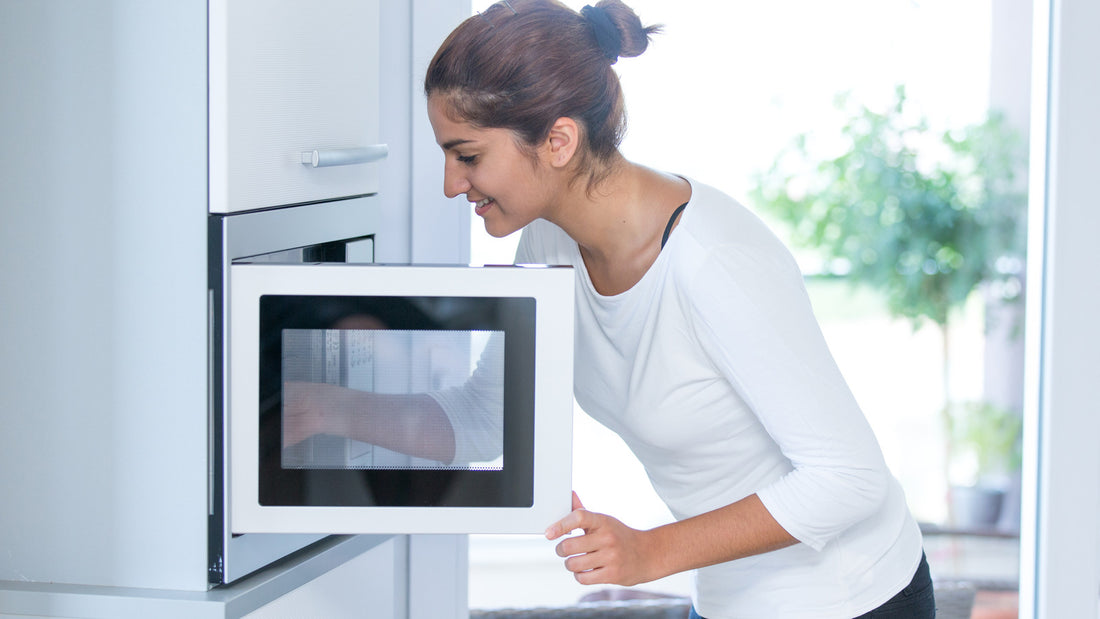 Girl using a microwave
