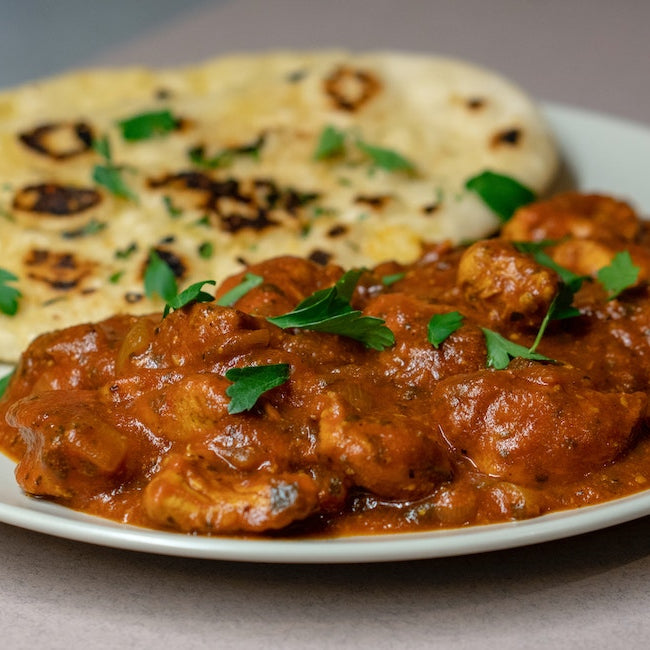 Chicken korma on a plate.