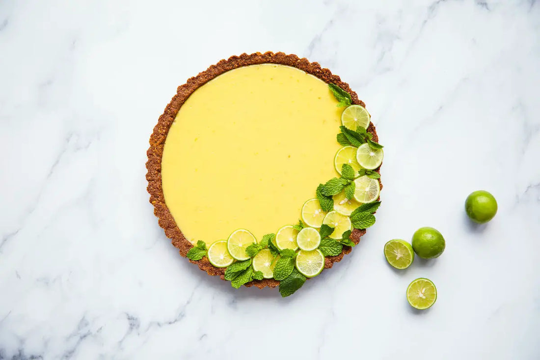 Key lime pie on a marble kitchen counter.