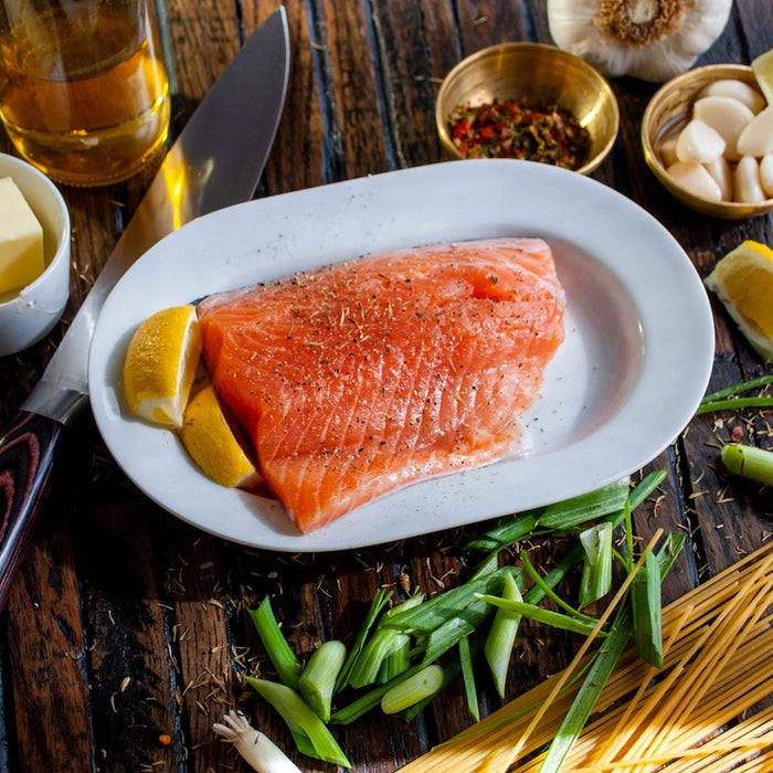 Marinating a salmon filet.