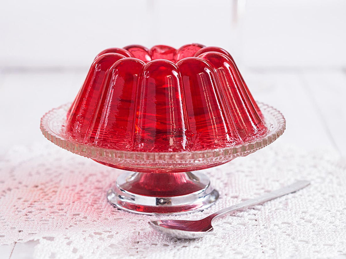 Red jelly on a cake stand.