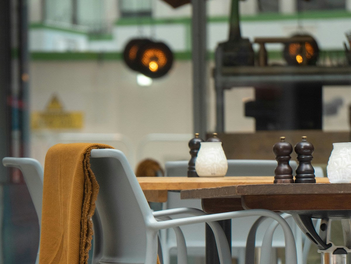 Salt and pepper shaker on a dining table.