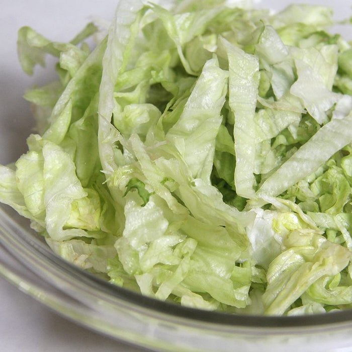 Shredded lettuce in a bowl.