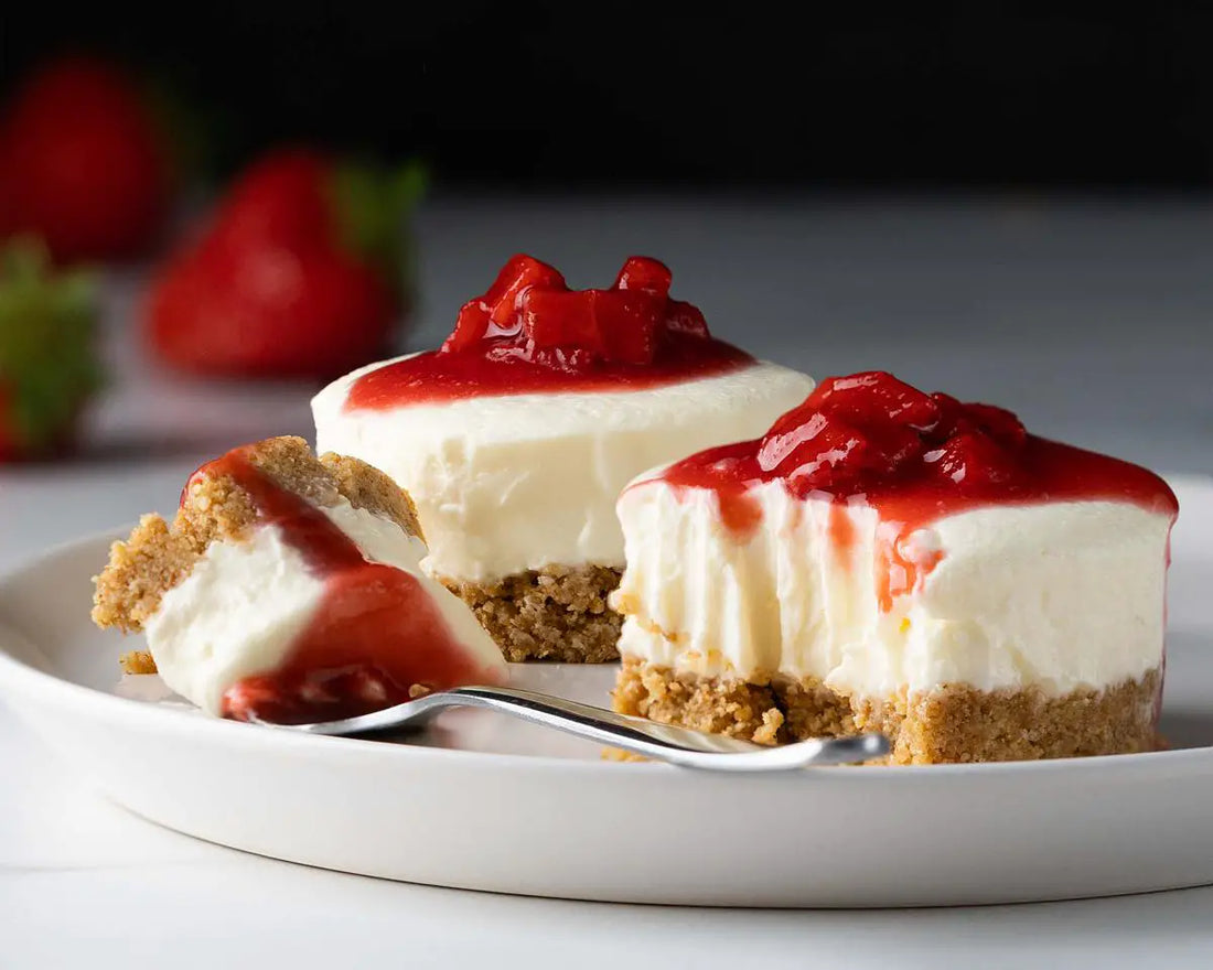 Strawberry mini cheesecakes on a plate.