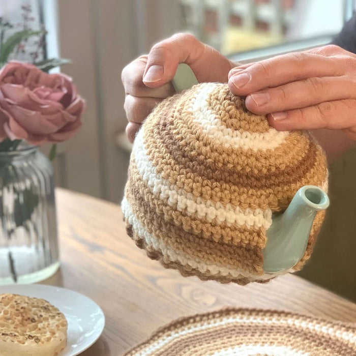 Tea cozy around a teapot.