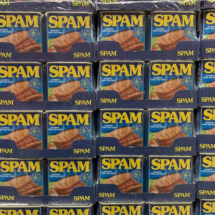 Tins of spam in a supermarket shelf.