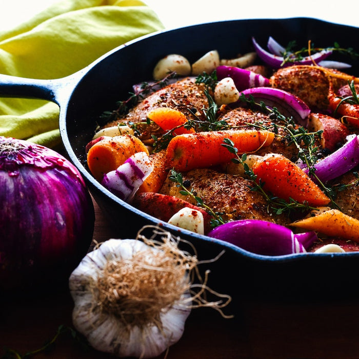 Vegetables frying in a skillet.