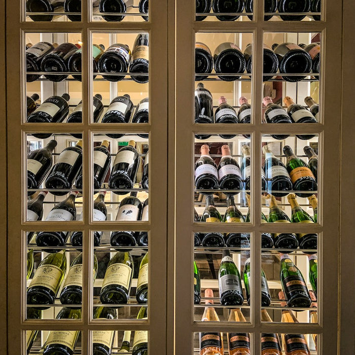 Wine collection in a wine cabinet.